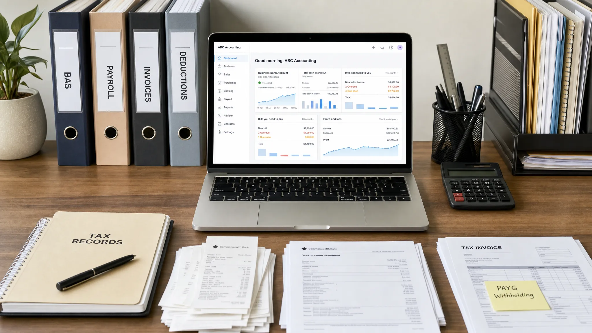 A professional desk with organised tax records, bank statements, receipts, a laptop facing the camera showing accounting software with no other screen displayed behind it, and labelled folders for BAS, payroll, invoices and deductions.