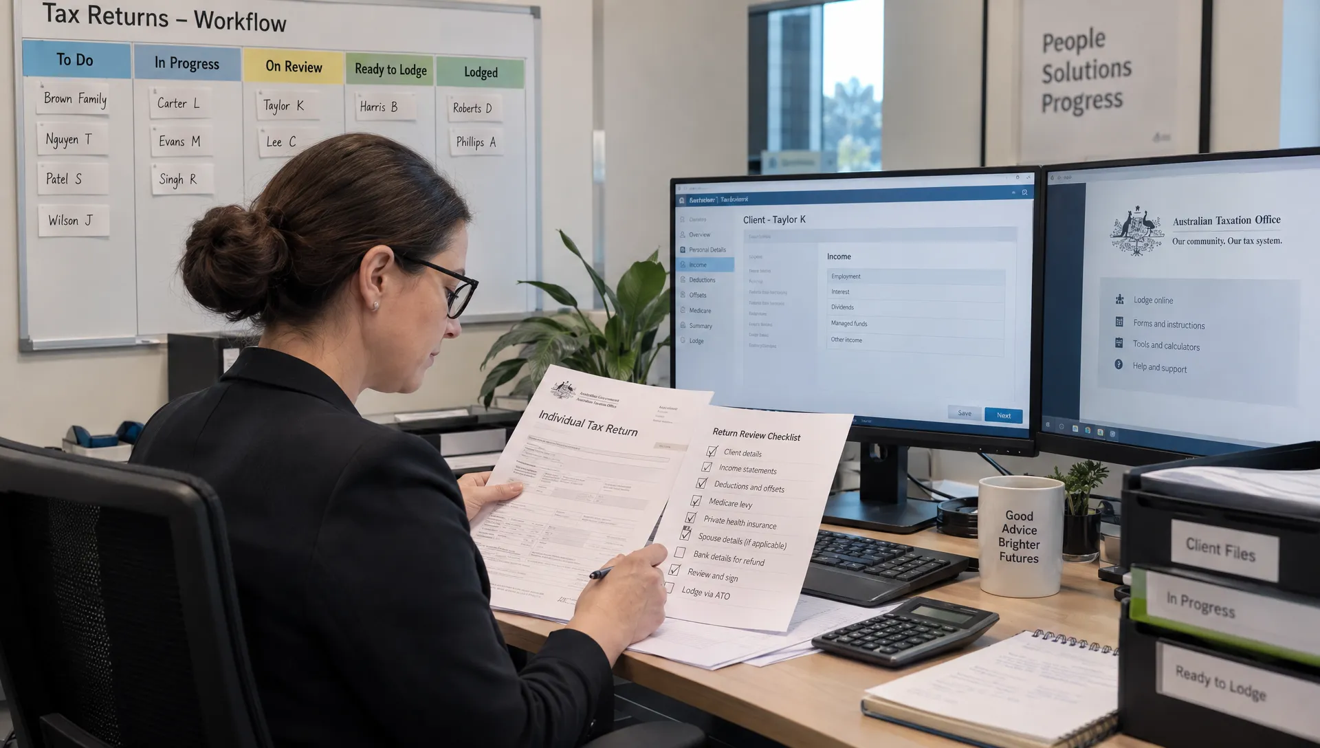 A tax practitioner checks a return against a review checklist at a workstation, with the practice workflow board visible behind them.
